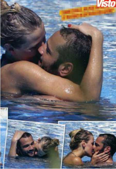 Veridiana Mallman e Rocco Pietrantonio scambiarsi un bacio appassionato a bordo piscina